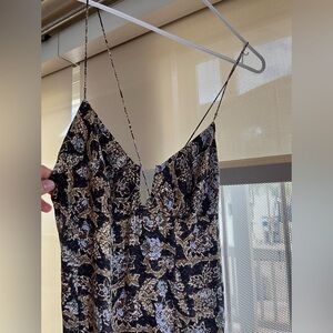 Free people maxi. backless, two strings join at the back with tiny charms.